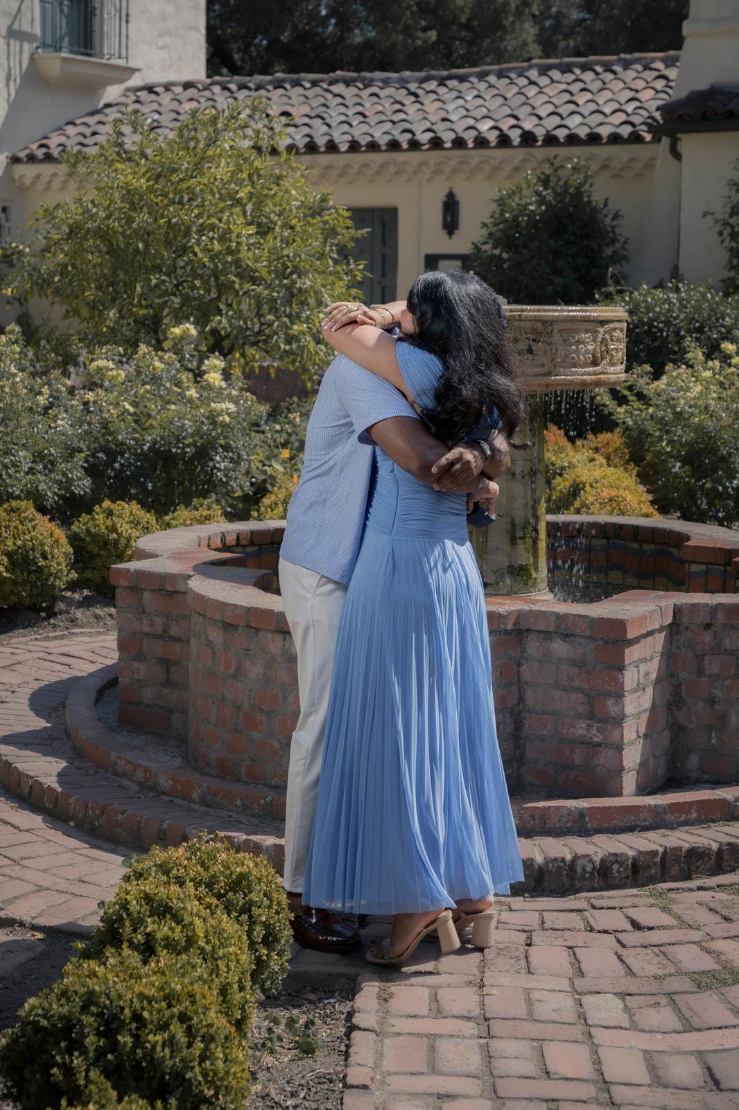 Embrace near fountain — Allied Arts Guild, Palo Alto