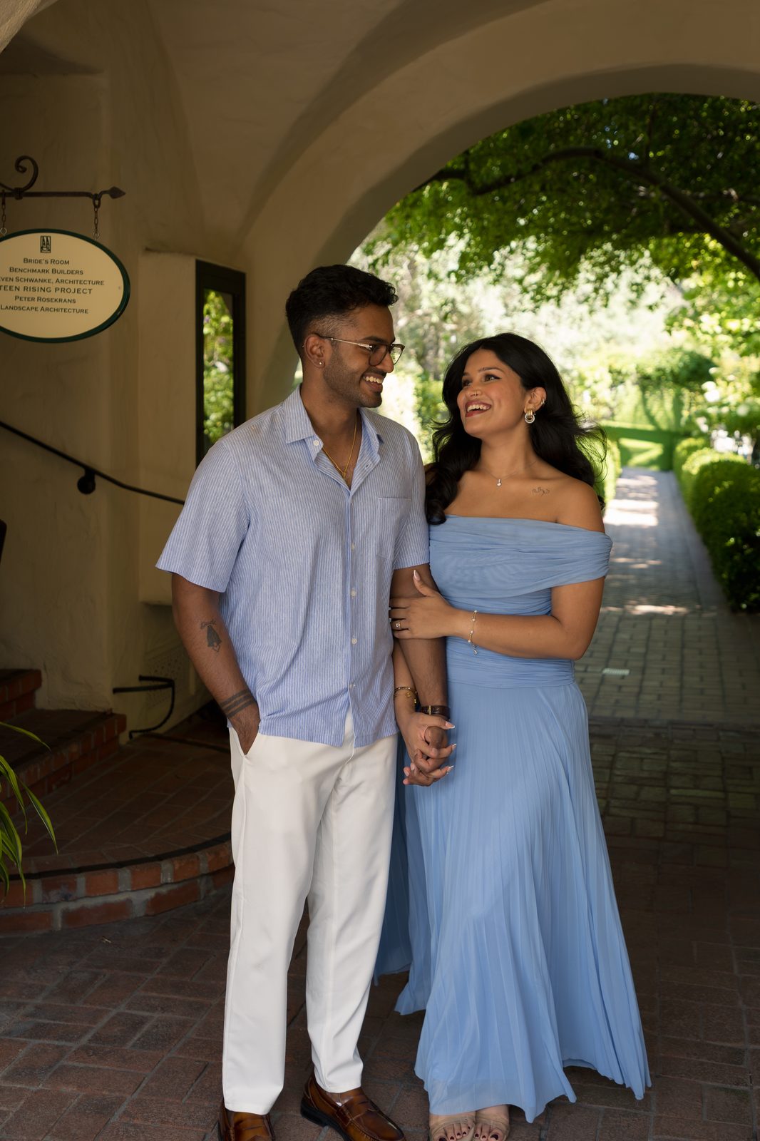 Couple laughing under archway — Allied Arts Guild, Palo Alto