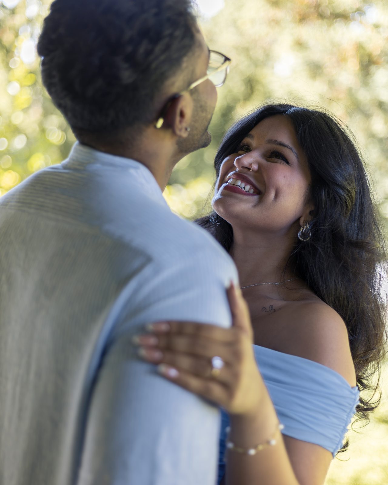 Couple laughing naturally during engagement session